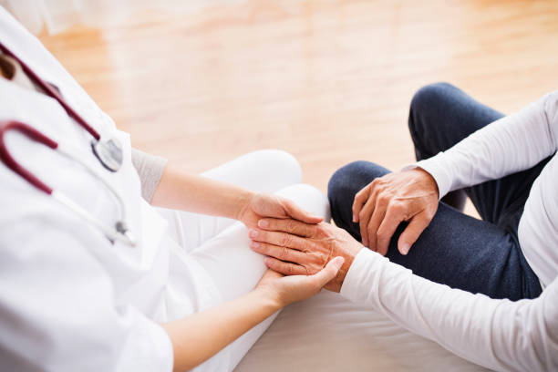 istock Health visitor and a senior man during home visit. 876523384
