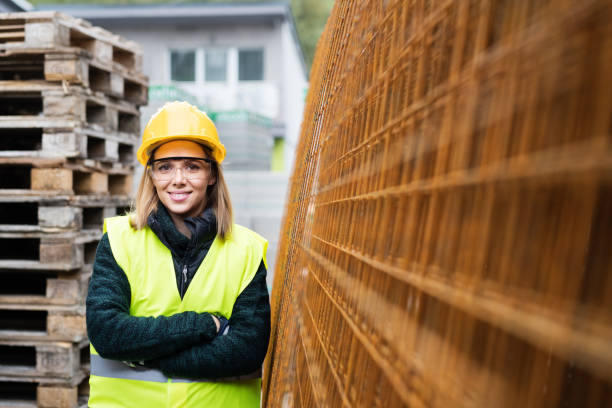 istock Young woman worker in an industrial area. 876530490