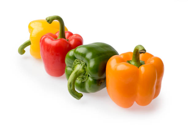 istock Colorful sweet peppers isolated on white background 876534486