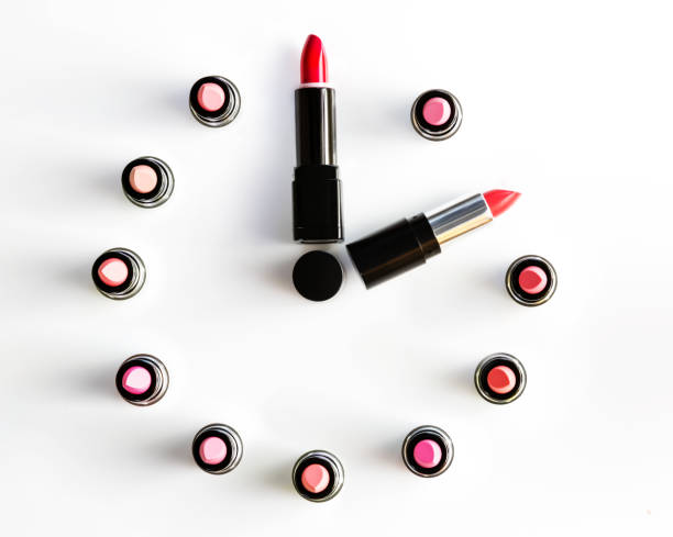 istock clock face and arrows on white background made from lipsticks 876535656