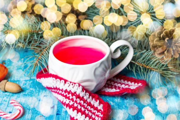 istock Cup of tea with fir tree and festive decoration 876535712