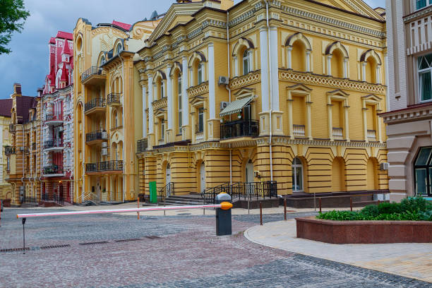 Car barrier and luxury houses in a classic style. Architecture