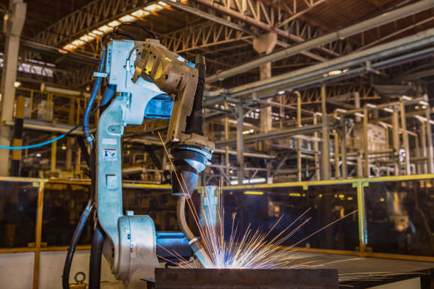 istock Industrial robot are test run new program in automotive assembly factory 876538606