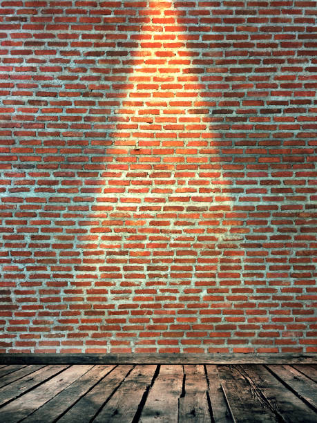 istock Red brick wall surface with down light and vintage wooden floor 876539802