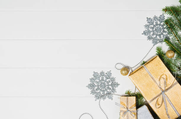 istock Christmas presents or gifts background frame top view on white 876542438