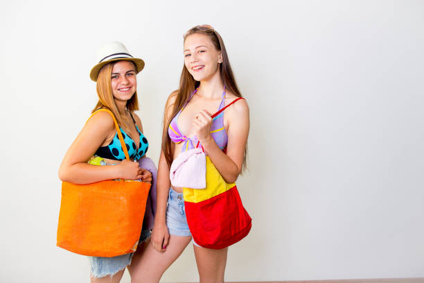 istock Girls on a beach 876543062