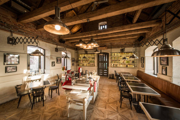 istock Tables and chairs in vintage loft restaurant 876545532