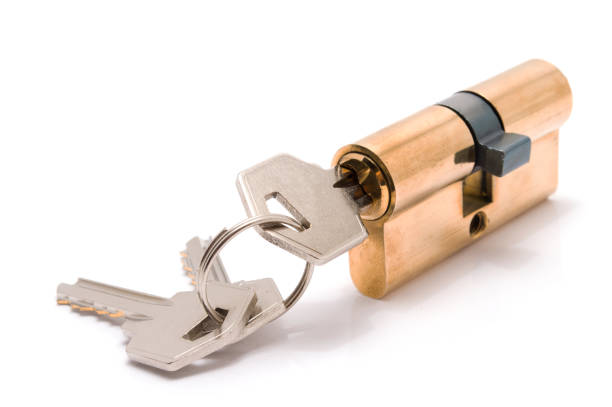 istock Cylinder lock with keys isolated on white background. 876547176