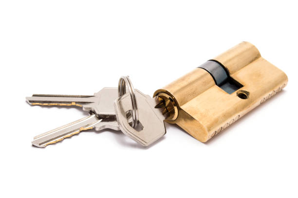istock Cylinder lock with keys isolated on white background. 876547178