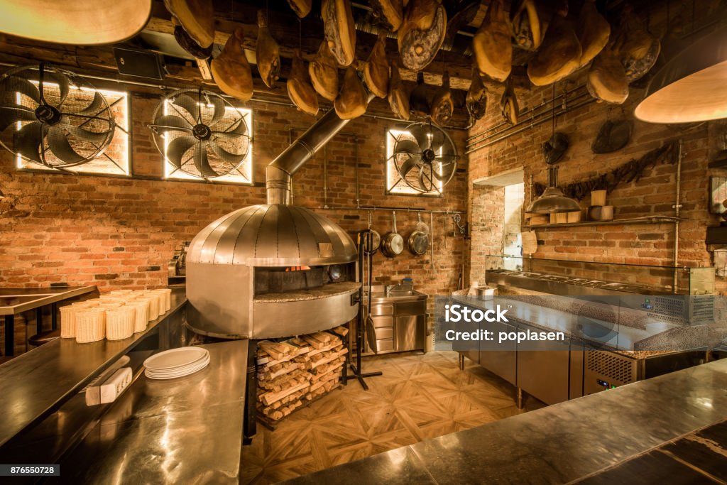 Pizza oven in open kitchen italian restaurant Kitchen Stock Photo