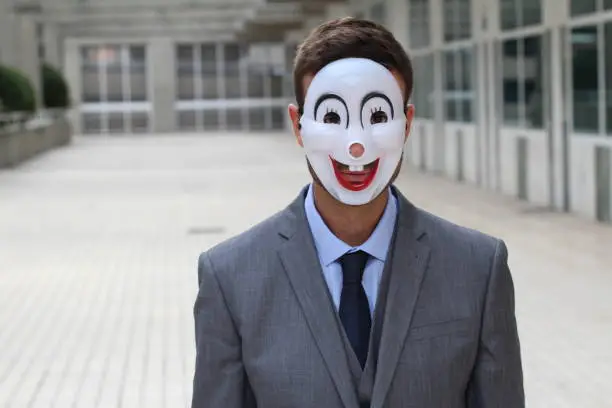 Photo of Scary businessman wearing a mask