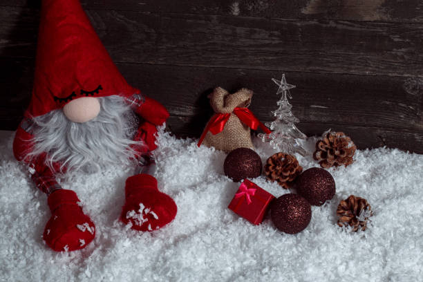 istock Composition with Christmas decorated and Xmas dwarf on rustic wooden background 876561154