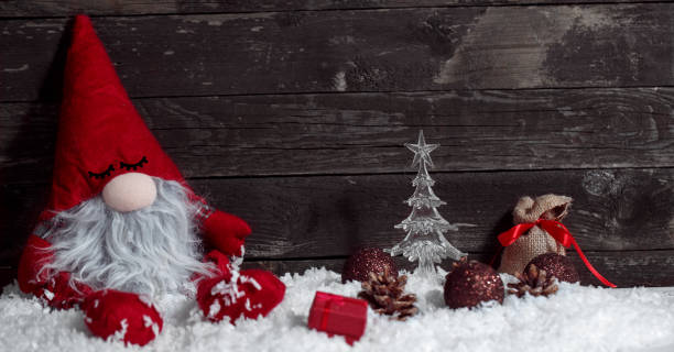 istock Christmas sleepy dwarf on snow with Christmas decorative 876561550