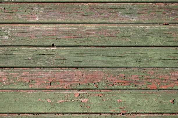 istock Old weathered rustic brown green and pink wood background texture. Simple for design ready mockup empty, noone. 876564270