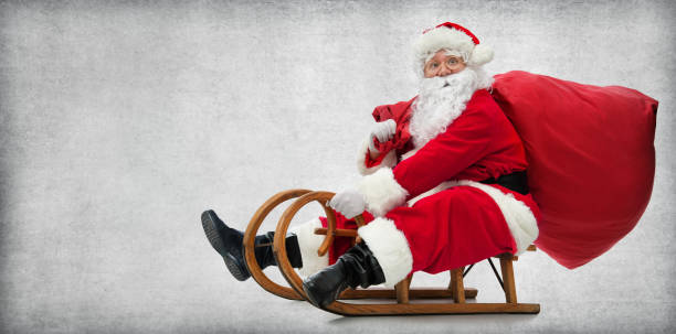 babbo natale sulla sua slitta - sled foto e immagini stock