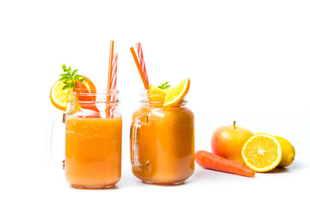 istock Carrot smoothie in a jar isolated 876564496