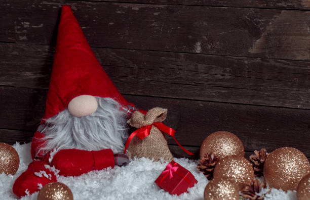 istock Christmas scene with Xmas dwarf decoration and snow 876565060