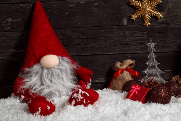istock Christmas or New Year decoration-Funny Christmas dwarf on snow with decorative 876567620