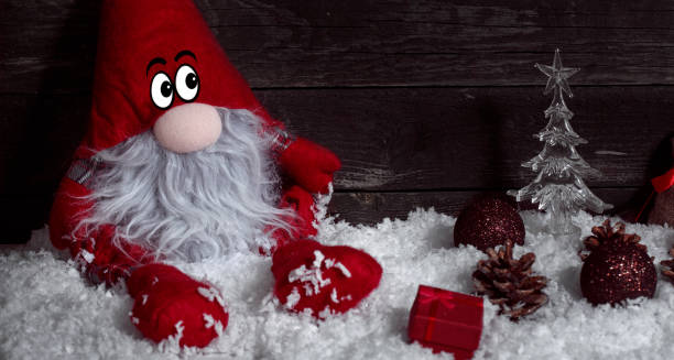 istock Funny Christmas dwarf on snow with Christmas decorative 876568872