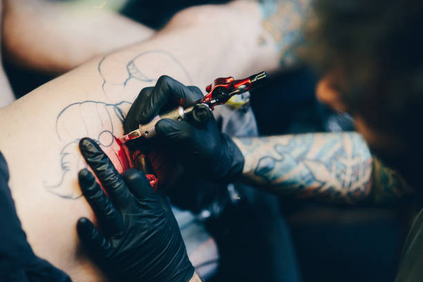 istock Professional artist making tattoo 876569460