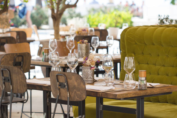 istock Empty glasses in restaurant / table set restaurant / restaurant with cozy interior / restaurant set. 876569524