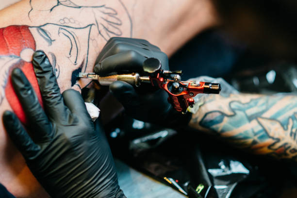 istock Close-up view of male hand making tattoo 876569830
