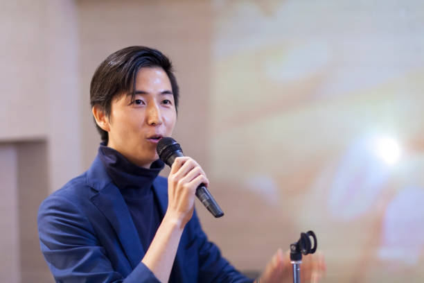istock Asian Businessman Giving Presentation 876570174
