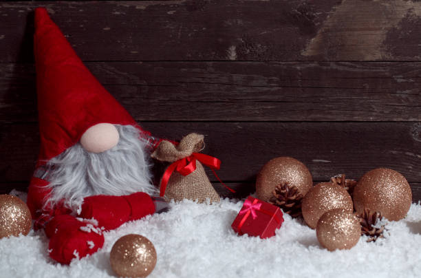 istock Christmas scene with decoration and snow on wooden board 876576122