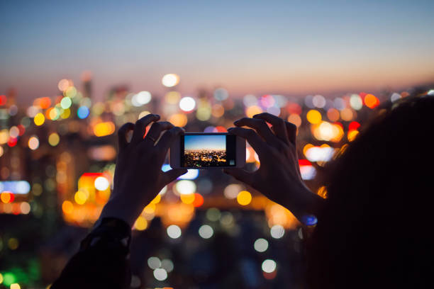 Girls Taking Photos with Cell Phone in Downtown District