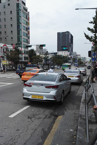 Seoul, South Korea - September 11, 2017: Korean taxi stop by at the busy street, waiting for passengers.
