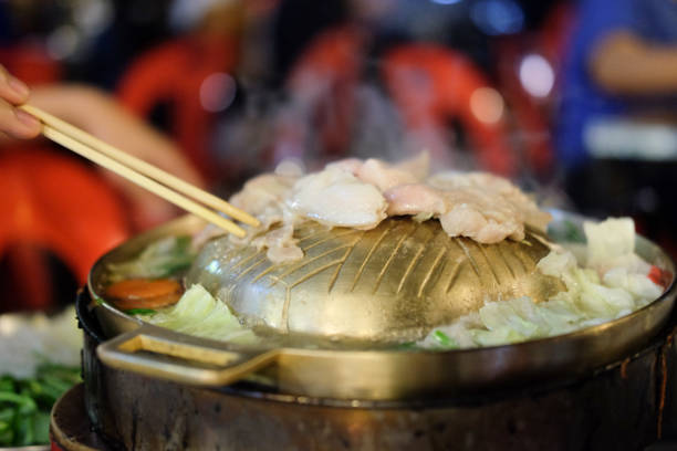 istock Thai barbecue and soup, buffet pig pan, food time 876580100