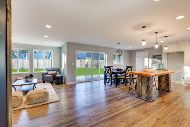 istock Open floor plan interior with polished hardwood floors 876580540