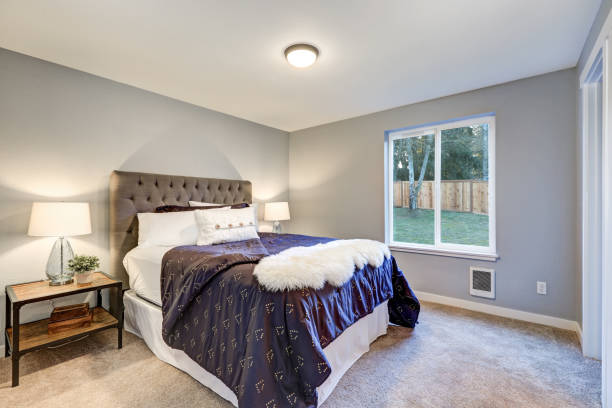 istock Lovely master bedroom with soft grey walls 876582696