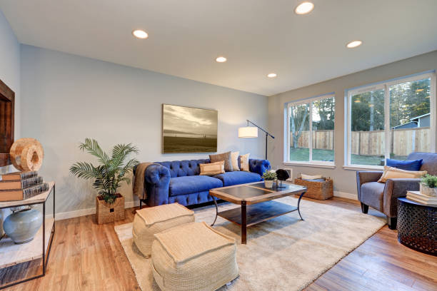istock Cozy light filled living space accented with warm blue walls 876582768