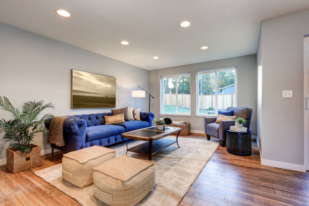 istock Cozy light filled living space accented with warm blue walls 876583030