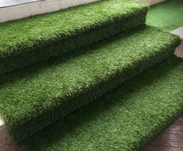 istock Closeup Green Artificial Grass Stairway 876586486