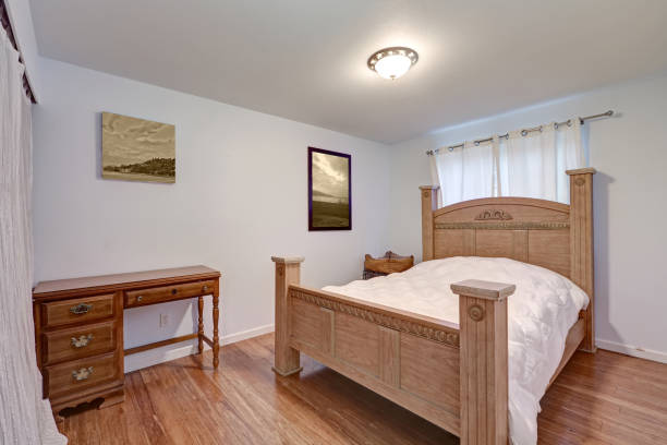 istock Lovely bedroom features gorgeous wood carved bed 876590882