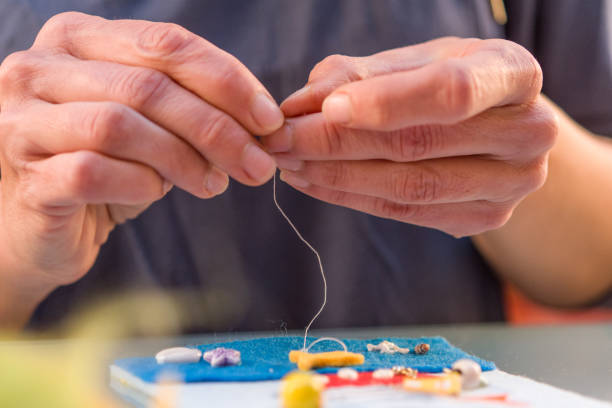 istock Woman Hand Sewing Soft Toys With Felt And Needle 876594254