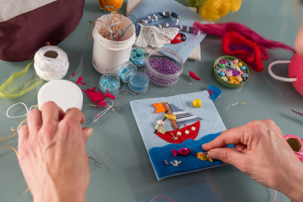istock Young Woman Hand Sewing Felted Toy Case 876594266