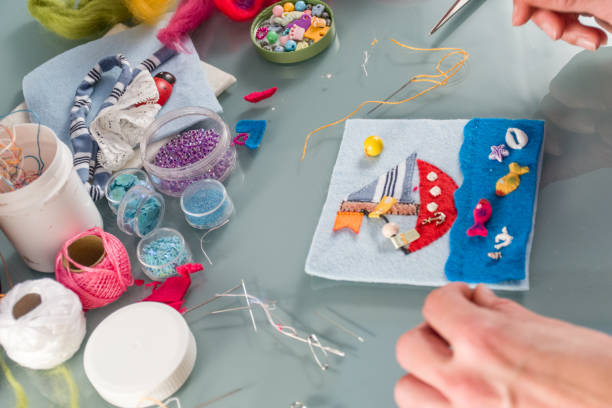 istock Young Woman Hand Sewing Felted Toy Case 876594272