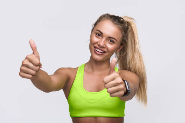 istock Woman gesturing thumbs up 876600616
