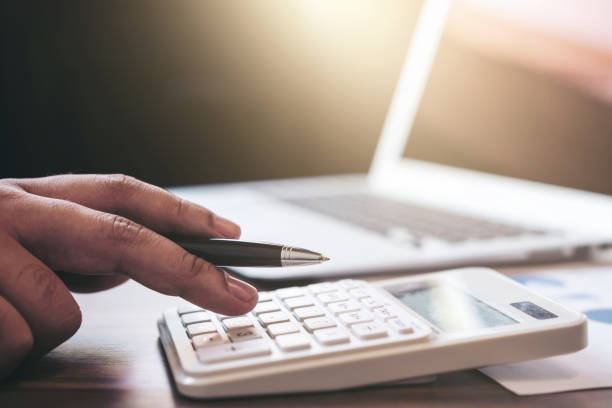 istock Professional businessman working with calculator, Doing finance on laptop, document graph and analysis business strategy to development profit 876600696