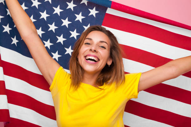istock Cheerful woman with USA flag 876601054