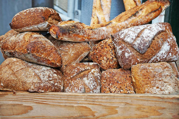istock Many different breads are stored in a wooden box. 876603940