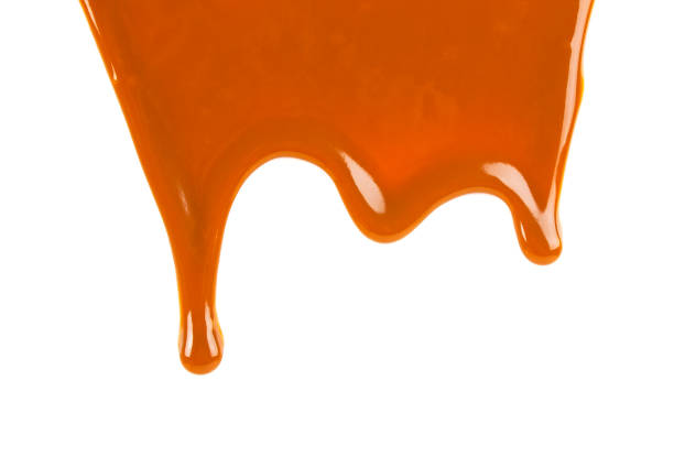 istock Caramel sauce isolated on a white background 876604040