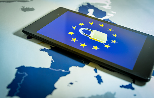 Padlock and EU flag inside smartphone and EU map, symbolizing the EU General Data Protection Regulation or GDPR. Designed to harmonize data privacy laws across Europe.