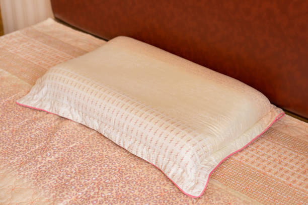 istock pillow on a bed in a bed room 876605288