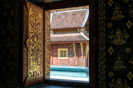 Exterior wall mosaic at Wat Xieng Thong in Luang Prabang : Luang Prabang, Laos - October 20, 2017