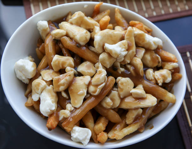 istock Close-up of poutine, Quebec traditional fast food. 876608044