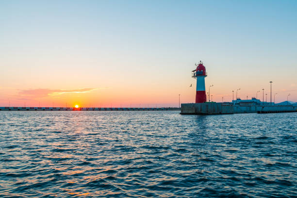 istock Sunset over Northern mole, Sochi, Russia 876608282